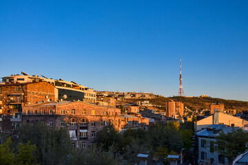 Yerevan TV tower and Nork hill at sunset scenic view from Tumanyan street in Kentron district...