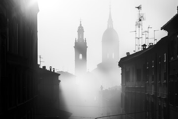 Sun shining through fog on italian city street with church