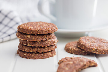 Sweet oatmeal cookies on white table.