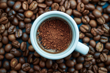 White cup with instant coffee granules on coffee beans background