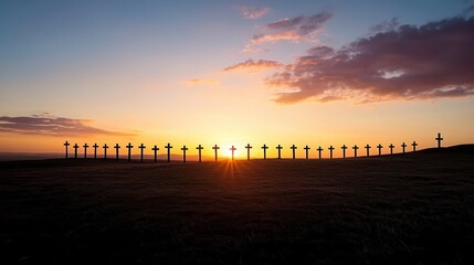 A row of crosses silhouetted against a vibrant colorful sunset sky creating a serene and contemplative scene in the peaceful rural landscape