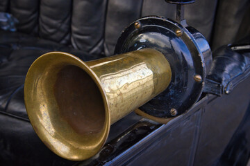 old brass horn on a vintage motor car