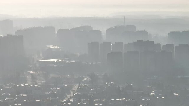 City in the morning fog Aerial shot from a drone. Dabrowa Gornicza in the morning fog.