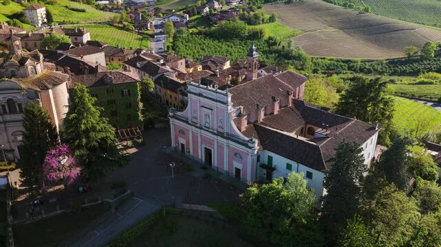 Church of Saints Peter and Paul at Neive, village in Piedmont, Italy. Aerial drone orbiting