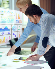 Composite collage. Team studying floating analytics dashboards with colorful graphs, timelines and structure icons in transparent UI style. Concept of virtual business, planning system, investments