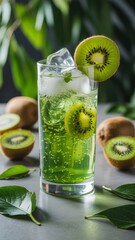 Refreshing Kiwi Fizz: A tall glass of vibrant green kiwi fizz, garnished with fresh kiwi slices and ice, sits on a gray surface surrounded by juicy kiwi fruits and lush green leaves.