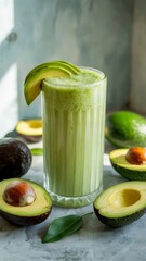 Refreshing Avocado Delight: A glass of vibrant green avocado smoothie, garnished with a slice of the fresh fruit, is complemented by the presence of the halved avocado.