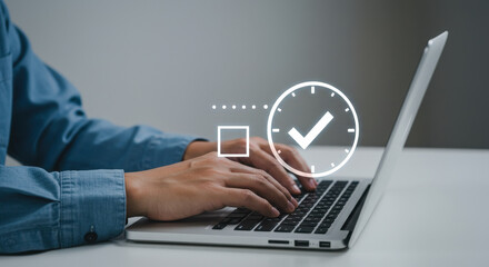 Completing tasks efficiently, a man in his 30s types on laptop to manage time well and stay organized