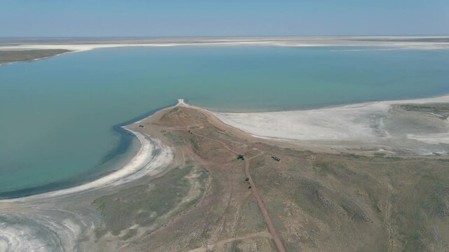 Drone Flight Over Lake Balkhash with Turquoise Water and White Shores. This cinematic flight captures the serene beauty of one of Central Asia&rsquo;s largest lakes. Perfect for themes of travel, adventure.