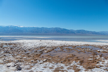 Badwater Basin with salt in death valley national park, California USA on a sunny day