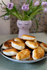 Homemade fried pies in a large plate. Close-up.