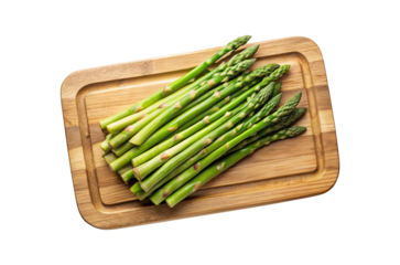 Fresh green asparagus spears arranged on a wooden cutting board ready to cook