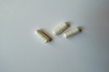 3 white capsules of acetyl cysteine dietary supplement from above