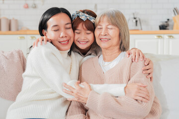 Asian multigenerational family grandmom mother and daughter nephew offspring and granddaughter...