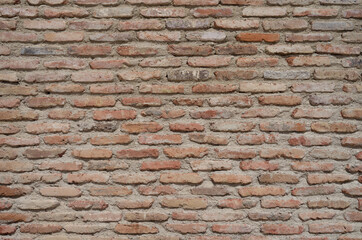 Old brick wall background, with long thin bricks