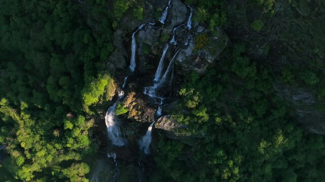 Acquafraggia waterfall landscape from above, rotating cinematic aerial