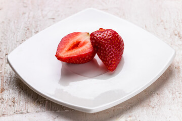 Sliced Strawberry on White Plate – Close-Up