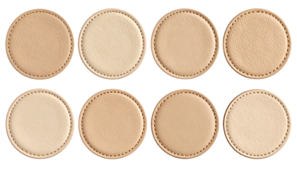 Set of round beige leather badges on white 