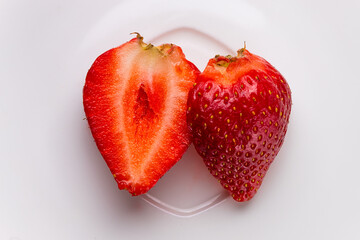 Sliced Strawberry on White Plate – Close-Up
