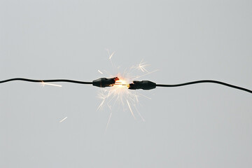 Electric failure of a broken thread with sparks