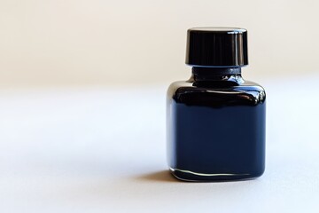 Black ink bottle isolated on white background
