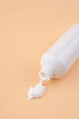 White plastic cosmetics container for cream