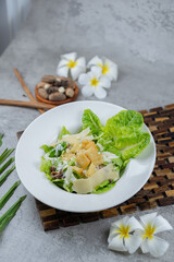 Fresh Caesar salad with romaine lettuce, crispy croutons, shaved Parmesan, and creamy Caesar dressing. A timeless favorite for menus and healthy food concepts.