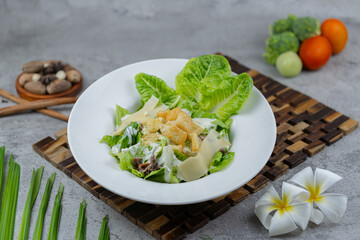 Fresh Caesar salad with romaine lettuce, crispy croutons, shaved Parmesan, and creamy Caesar dressing. A timeless favorite for menus and healthy food concepts.