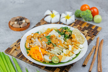 Traditional Indonesian salad made of boiled vegetables, tofu, eggs, and tempeh, served with rich peanut sauce. A flavorful and healthy plant-based dish.