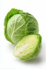 Fototapeta premium One whole cabbage green and one cross-section slices. Clean white background