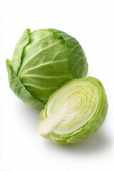 Fototapeta premium One whole cabbage green and one cross-section slices. Clean white background