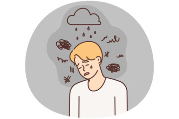 Depressed man crying due to bad weather and stress needs support psychotherapist
