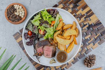 Juicy tenderloin steak grilled to perfection, served with herbs and vegetables. A premium meat dish perfect for gourmet menus, food photography, and fine dining visuals.