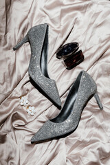 Artistic Long Exposure Wedding Accoutrements – Luxury Perfume, Zirconia Heels & Pearl Earrings © Katarzyna Ledwoń