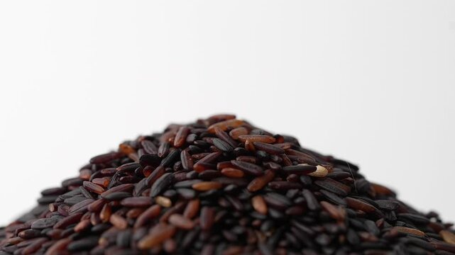 Macro video of black rice kept on rotating disk. Close up video of organic black rice.