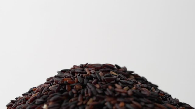 Macro video of black rice kept on rotating disk. Close up video of organic black rice.