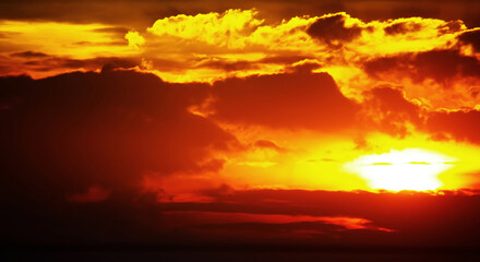 The twilight sky phenomenon shows a sky that is as hot as fire with glowing clouds. Image use for natural abstract background and meteorology forecast presentation.
