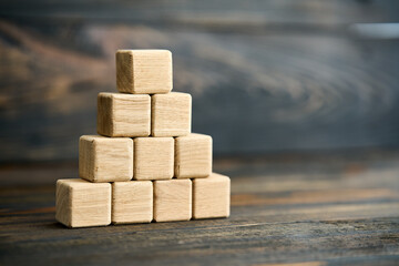 Pyramid of blank wooden cubeswith copy space
