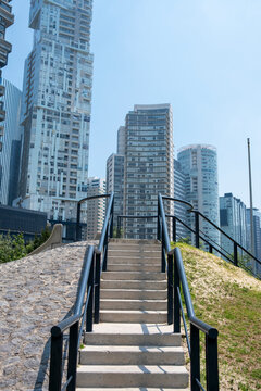 Staircase in La Mexicana Park, Santa Fe, Mexico City, modern urban landscape with tall buildings and pathways, ideal for architecture and lifestyle stock photography.