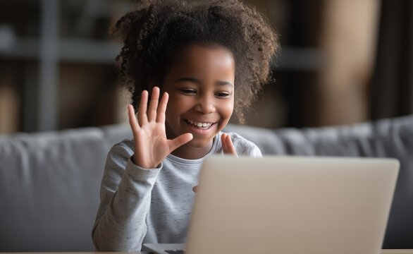 A young deaf black girl student engages in an online video call on his laptop, using sign language while focused on the screen