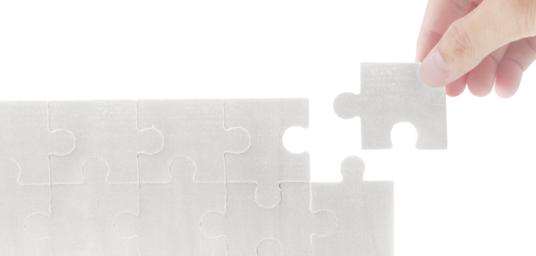 Completing a puzzle piece indoor setting visual content minimalist environment close-up view problem solving concept