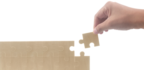 Placing puzzle piece home setting instructional image indoor environment close-up view problem-solving concept