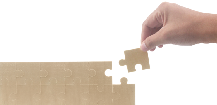 Placing puzzle piece home setting instructional image indoor environment close-up view problem-solving concept