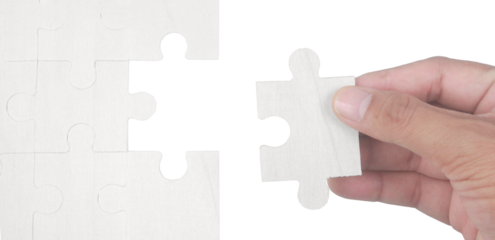 Placing final puzzle piece indoor table photo series minimalist environment close-up view puzzle concept