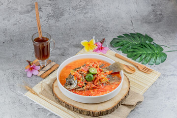 Traditional Indonesian fried fish dish served with spicy pecak sauce made from chili, shallots, and herbs. A bold, flavorful meal perfect for authentic food visuals.