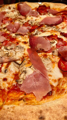 Delicious Homemade Pizza with Prosciutto and Mushrooms