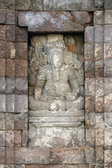 Vertical view of Ganesh or Ganesha god on exterior of ancient hindu Gedong Songo V temple wall, Bandungan, Semarang, Java, Indonesia