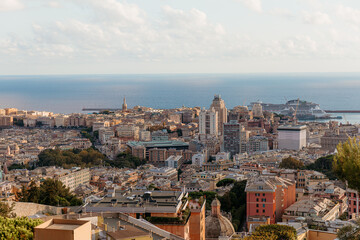 Naklejka premium Panoramic view of genoa showing the colorful buildings, port, and ligurian sea