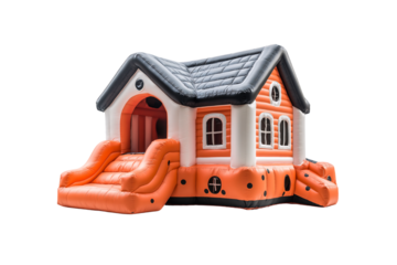 Orange and white cottage-style bouncy house with black pitched roof and slide, isolated on a transparent background