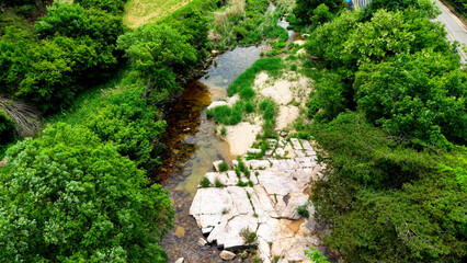 Aerial Drone Footage of a Clear Mountain Stream Flowing Through Mungyeong Countryside in Late Spring and Early Summer, Korea